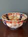 Hand-painted Imari porcelain bowl with an elegant scalloped rim