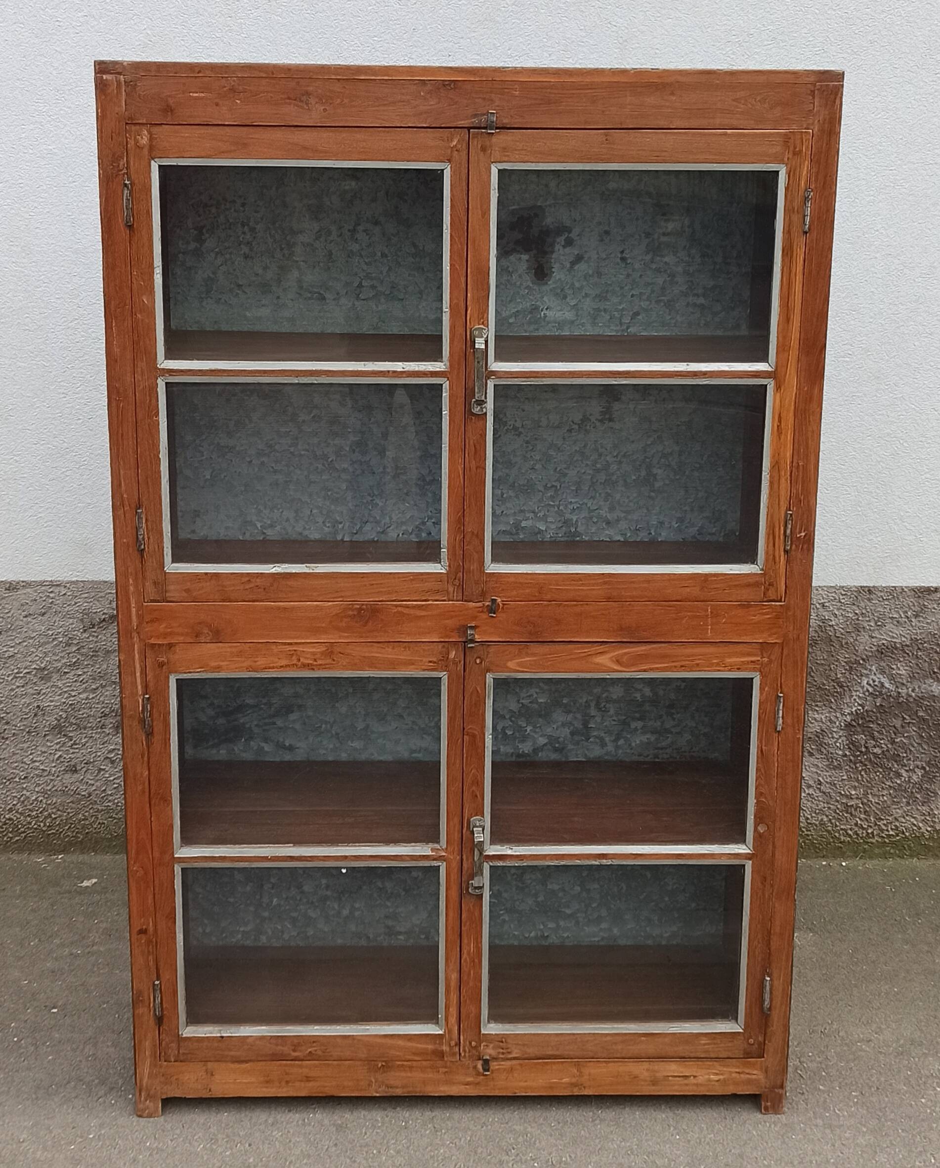 Old glass cabinet in wood and metal