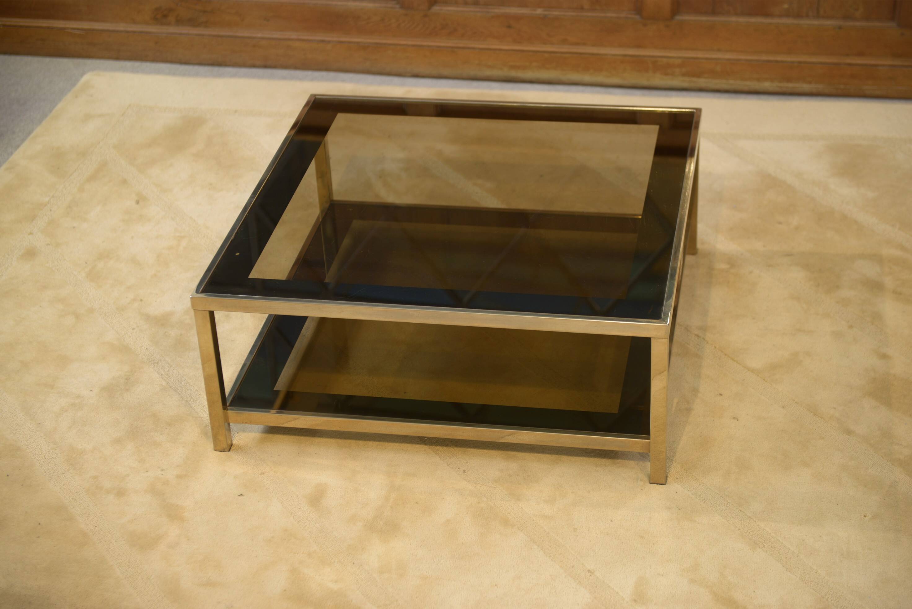 Hollywood Regency coffee table in smoked glass with mirrored framing from the 1970s.