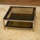 Hollywood Regency coffee table in smoked glass with mirrored framing from the 1970s.