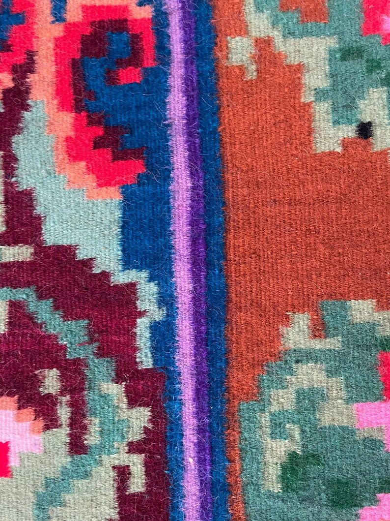 Rug with floral design on a blue background made by hand in Romania