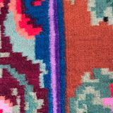 Rug with floral design on a blue background made by hand in Romania
