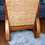 Ancien fauteuil bas colonial style Art Déco en bois.