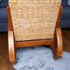 Ancien fauteuil bas colonial style Art Déco en bois.