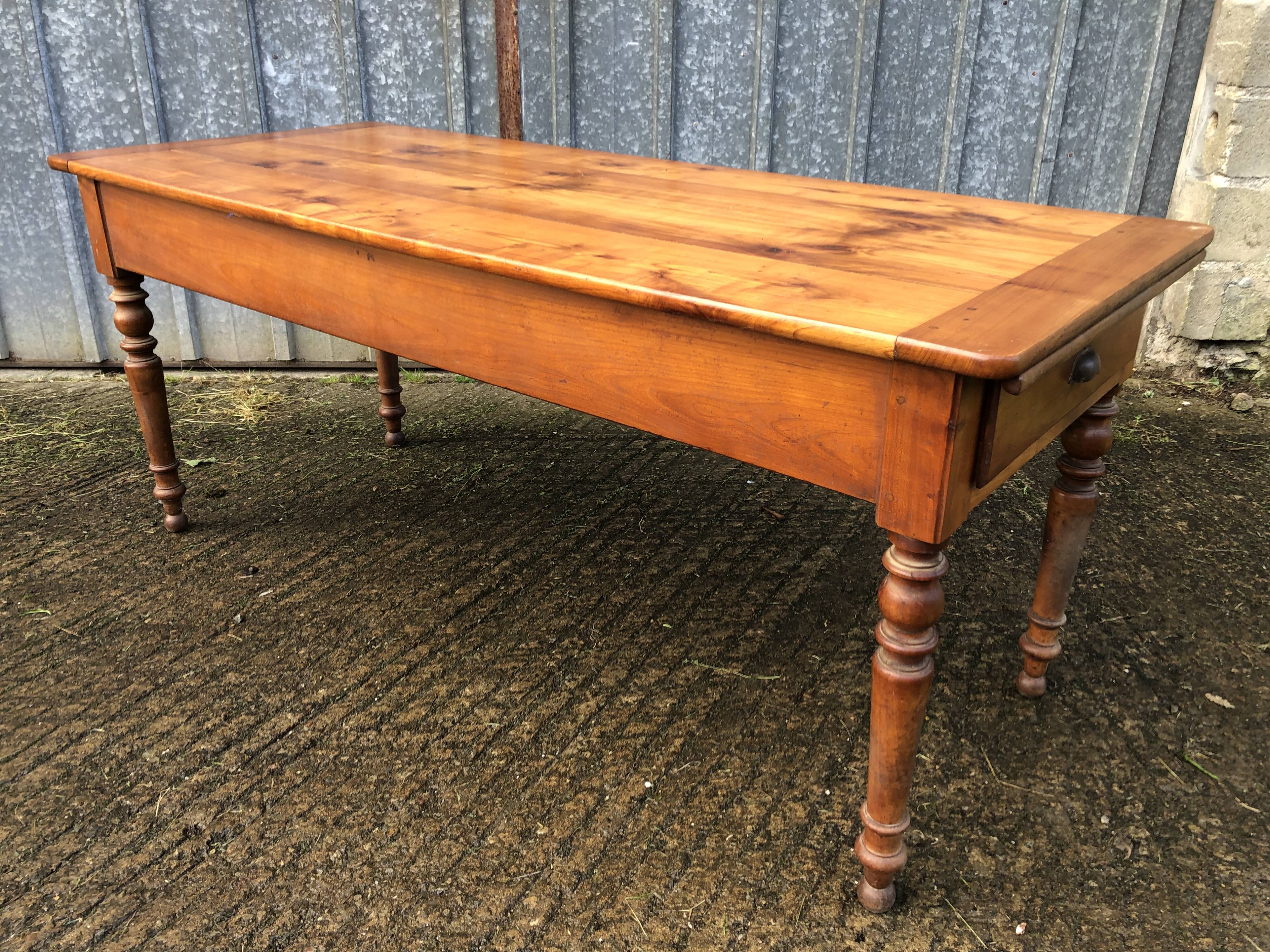 Antique farmhouse table in solid cherry wood in Louis Philippe style.
