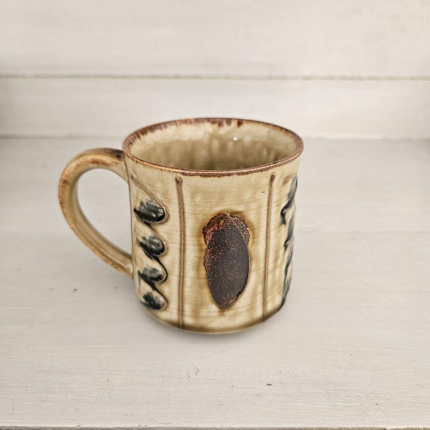Set of 4 ceramic mugs, glazed stoneware, assorted vintage designs.