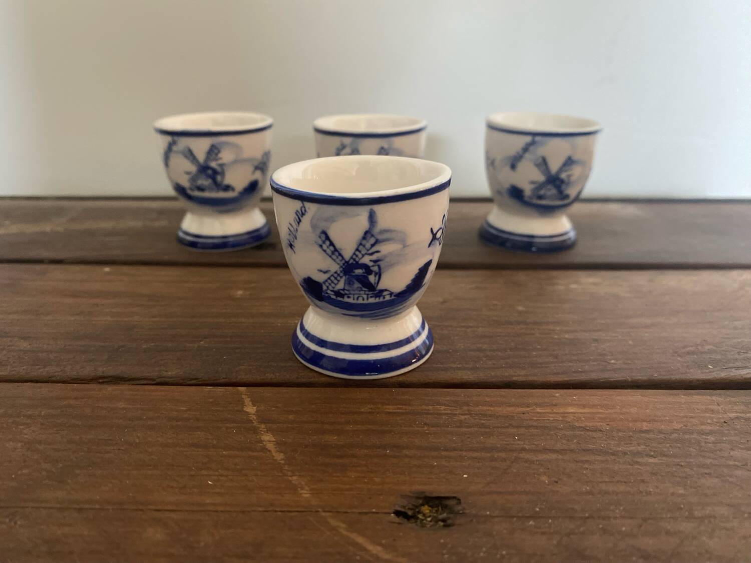 Set of 4 antique delft egg cups, white ceramic with blue vinta decor
