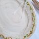 Oval plate, hand-painted meat platter in orange and green.