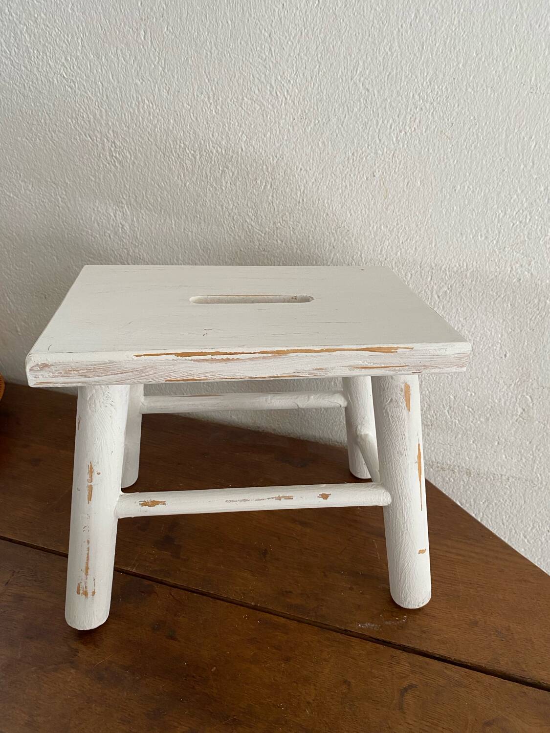 Small footrest bench in patinated white wood