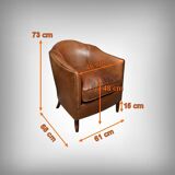 Solange club armchair in sheepskin leather.