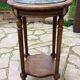Old wooden pedestal table with marble top