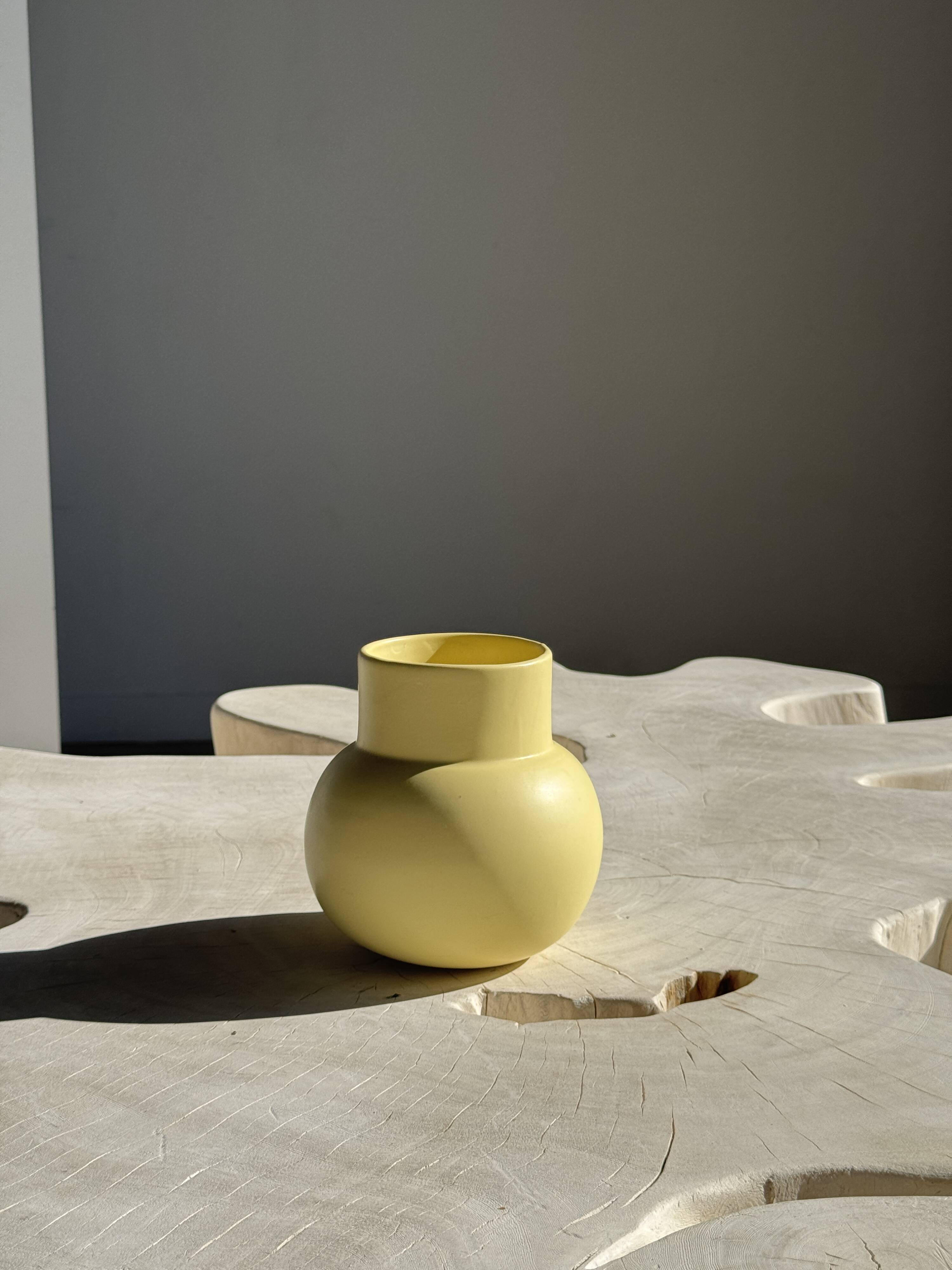 Small light yellow ball vase