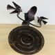 Brutalist wrought iron candle holder with birds