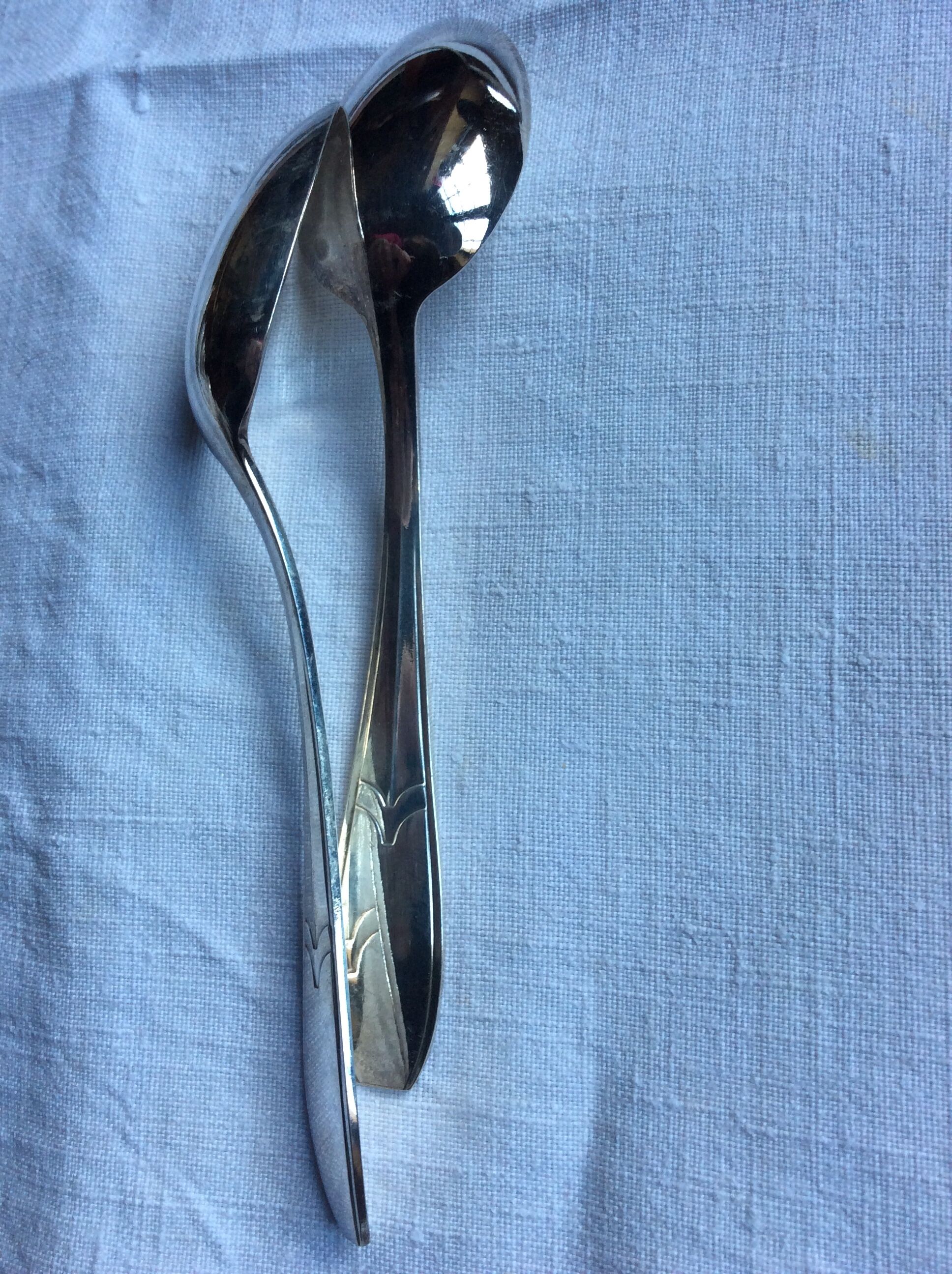 12 small art deco spoons, silver metal