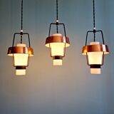 Trio of Scandinavian pendant lights in opaline and copper metal, 1960s