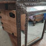Mirror with embossed brass bead