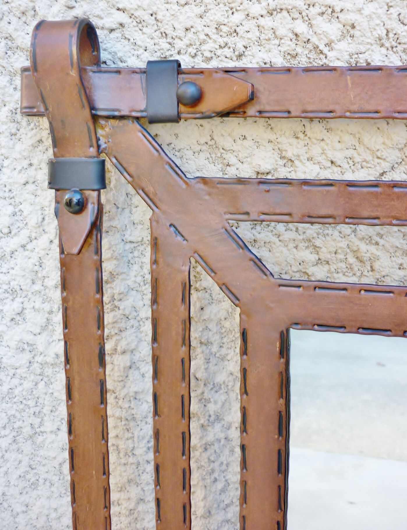 Metal mirror, wrought iron imitation leather straps and horse harness