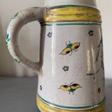 Old ceramic pitcher (18th century?) decorated with polychrome exotic birds