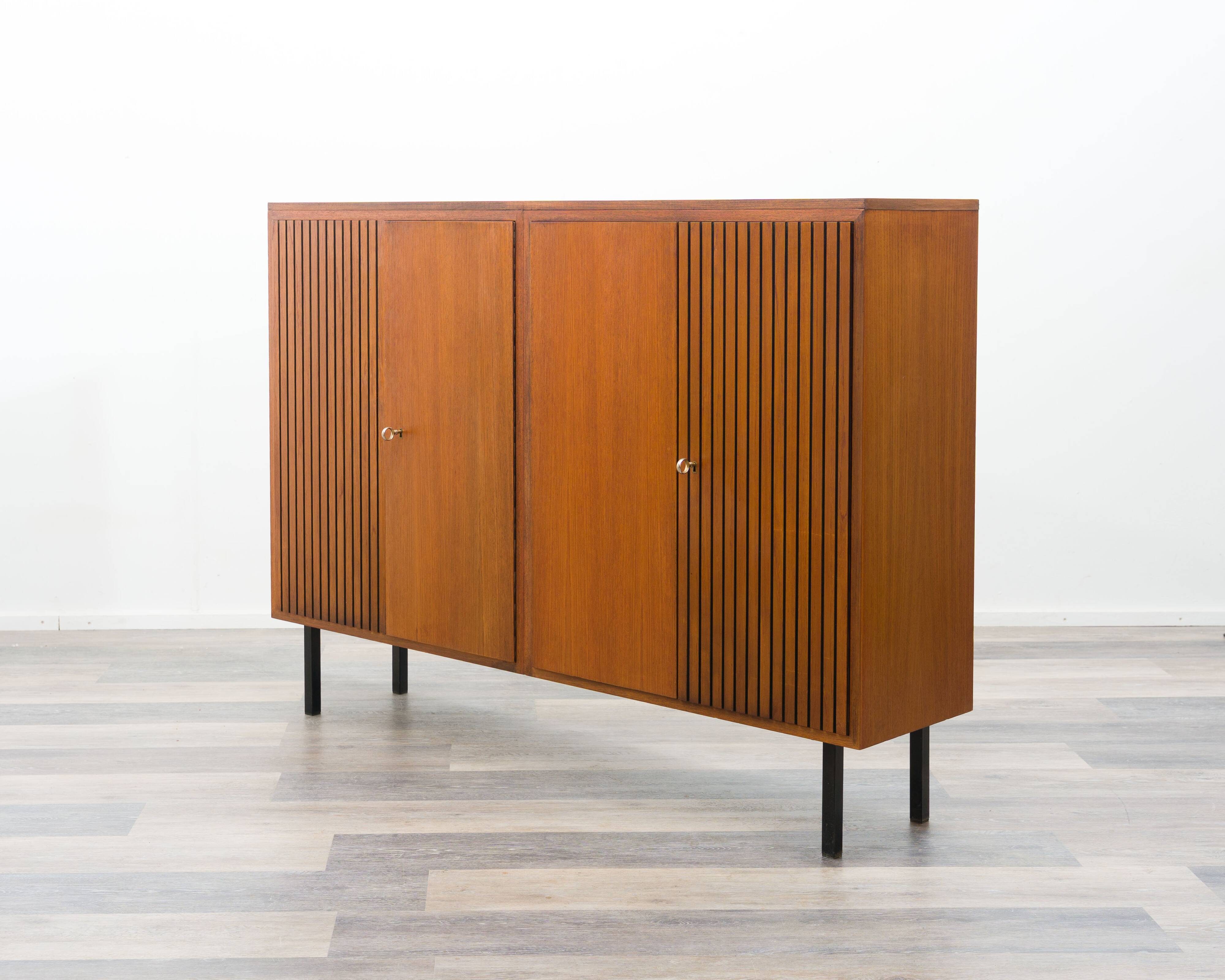 Large high teak sideboard with fluted doors, 1960s