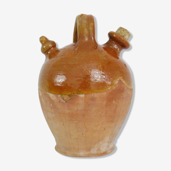 Old gargoulette jug, chevrette, water pitcher in glazed yellow sandstone. Mid-twentieth century