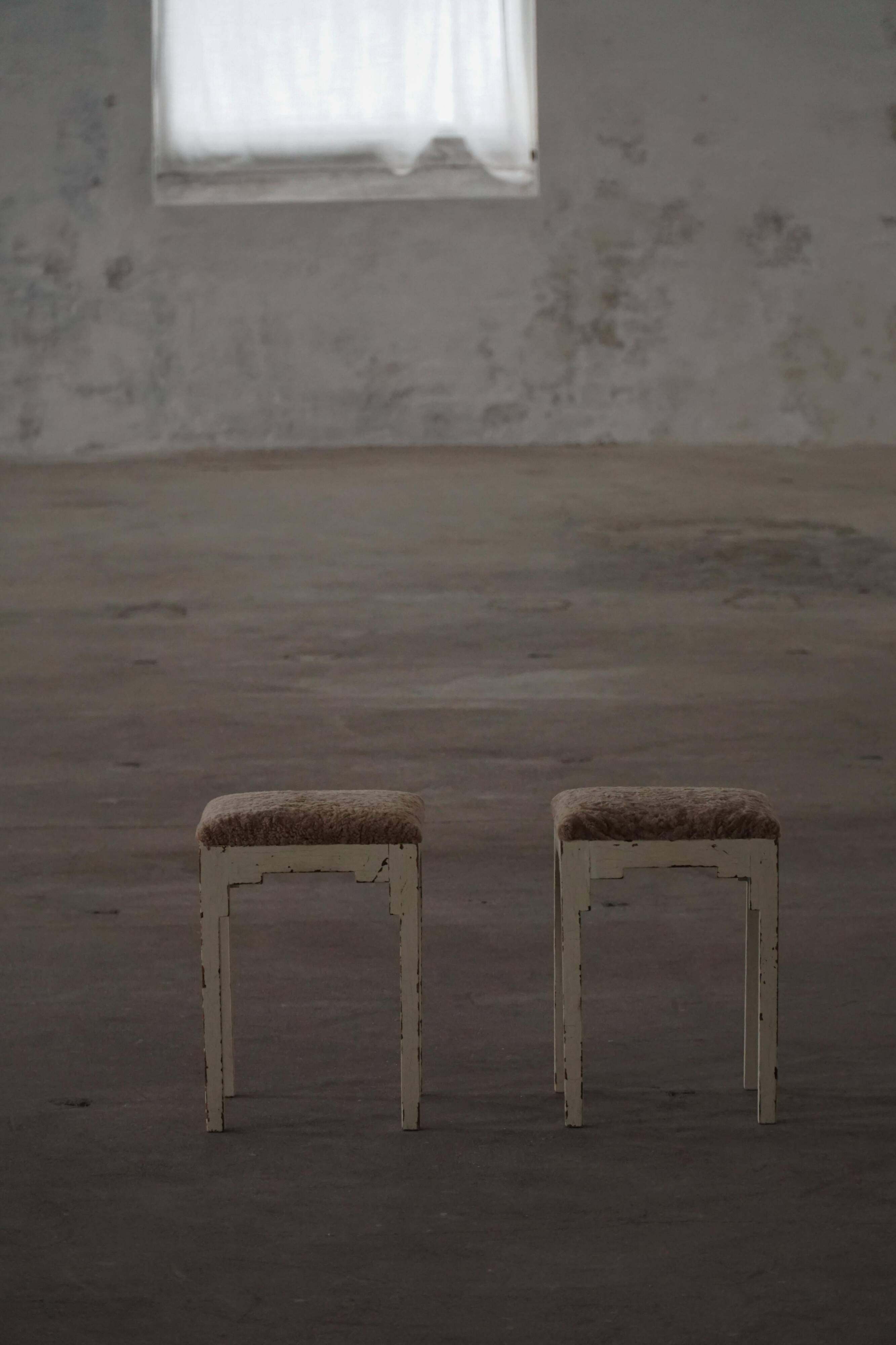 A pair of antique Danish stools, seats in lambswool, late 19th century.