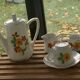 Porcelain dinette for dolls consisting of a coffee maker, cups and saucers, vintage