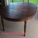 Round pine table with three extensions.
