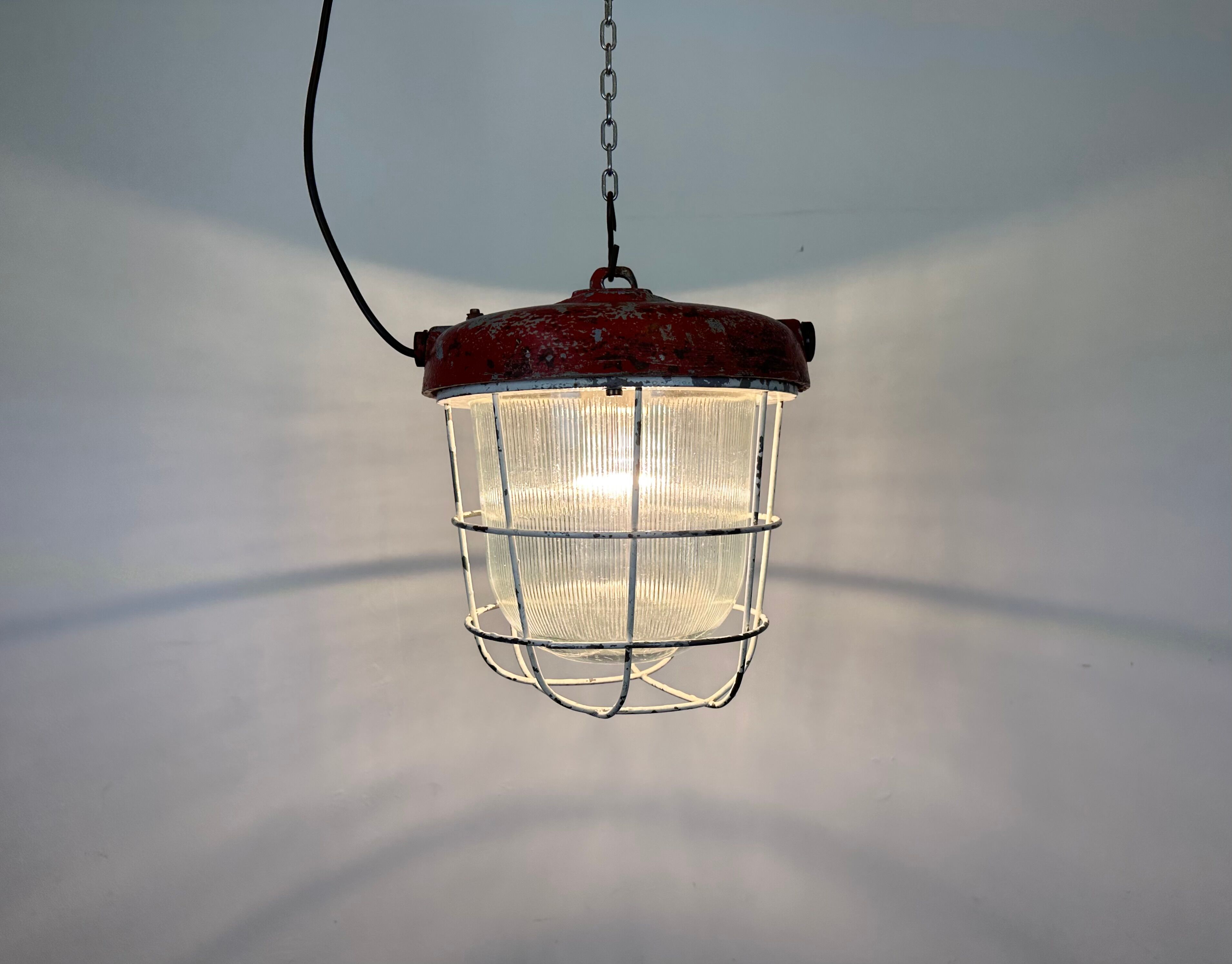 Red industrial cast iron cage pendant light, 1960s