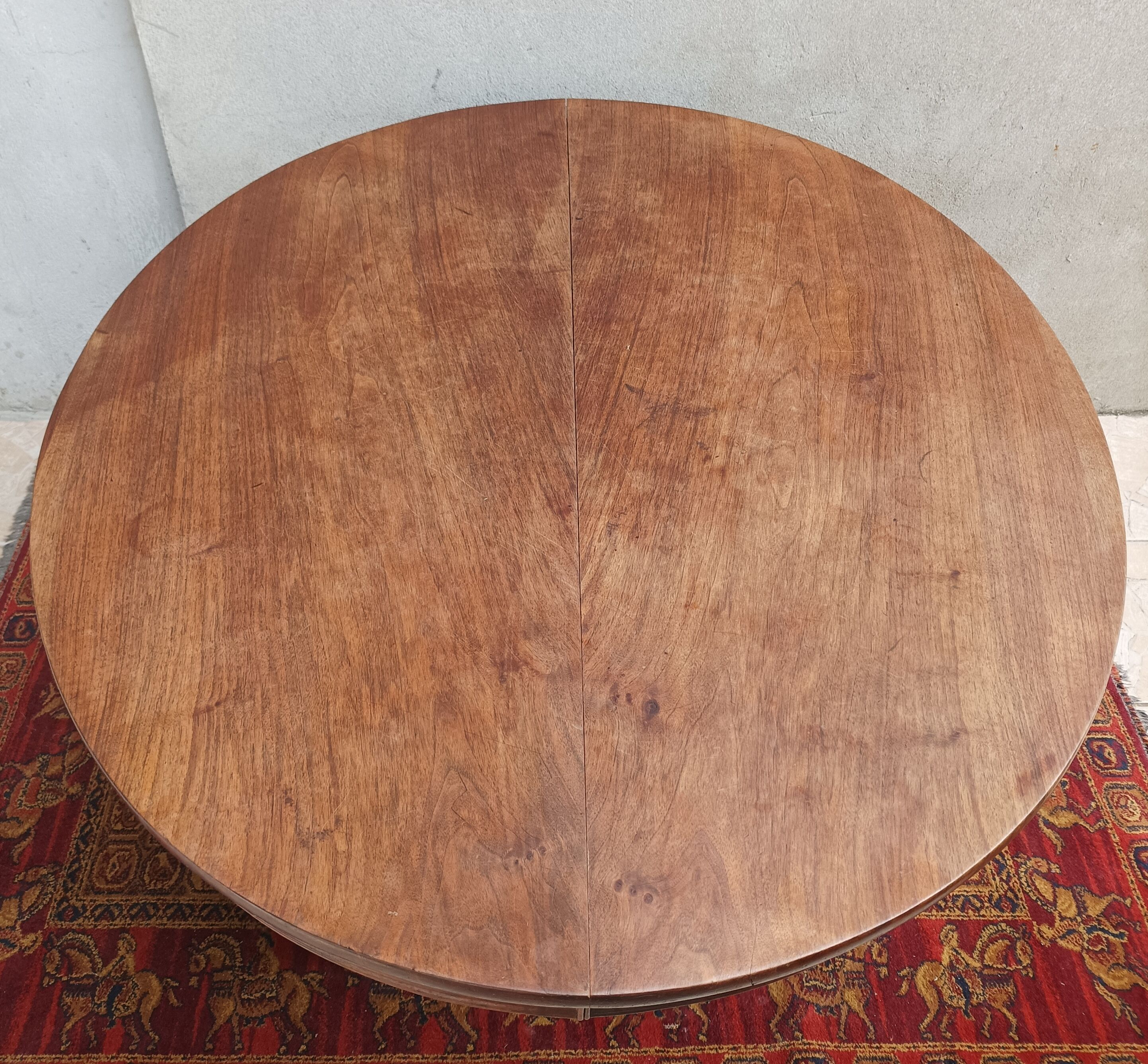 English oval table with 19th century mahogany extensions