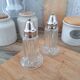 Glass and metal salt and pepper shakers