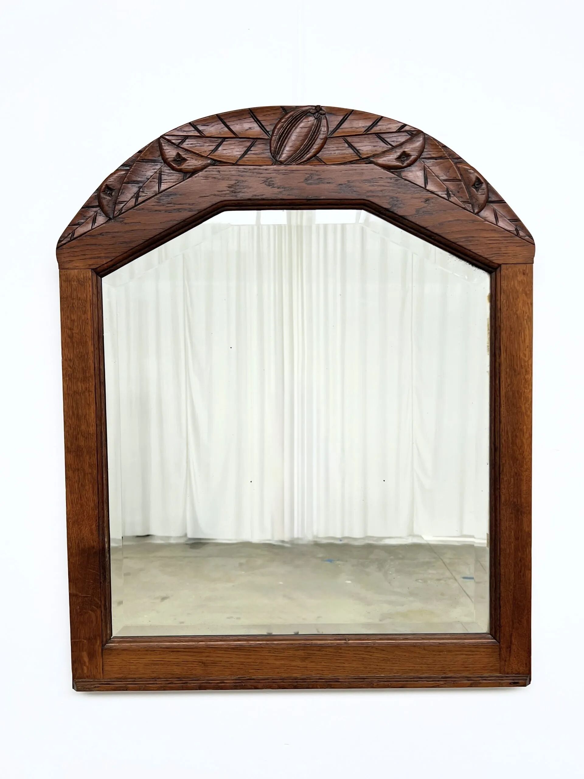 Art Deco oak mirror with carved motif