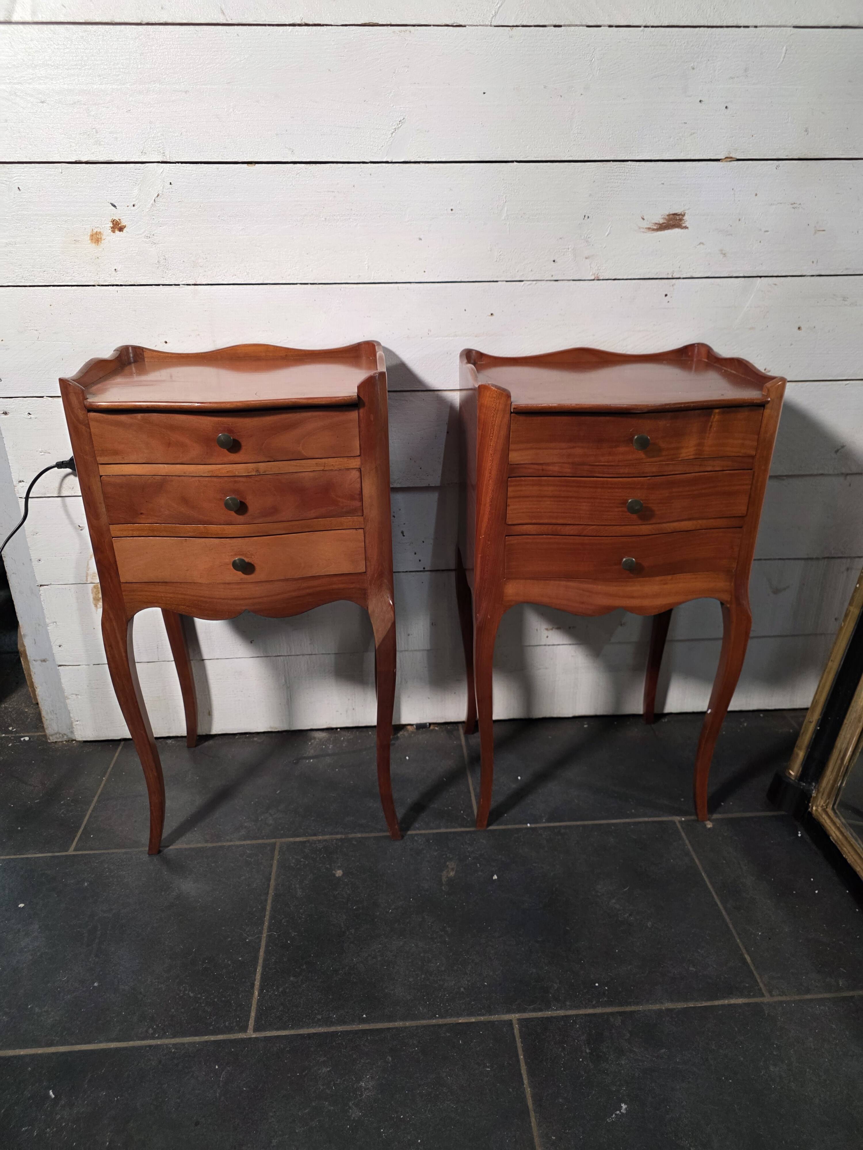 Pair of Louis XV style bedside tables in cherry wood.