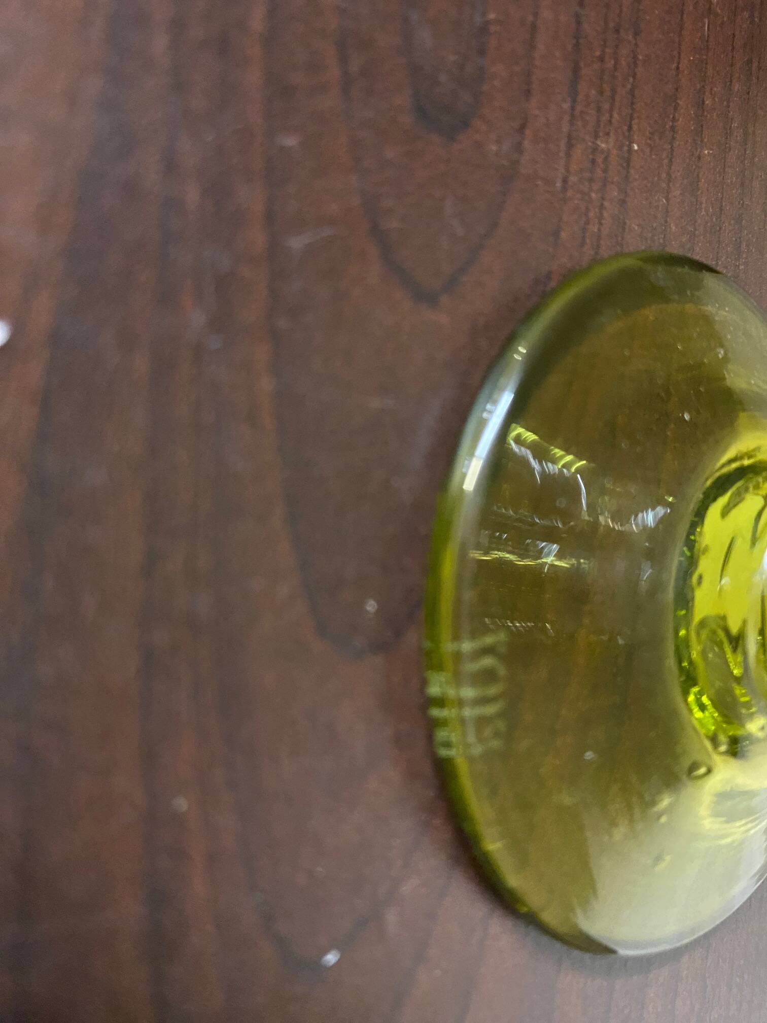 Biot candle holder in blown glass with anise green bubbles and handle