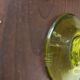 Biot candle holder in blown glass with anise green bubbles and handle