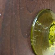 Biot candle holder in blown glass with anise green bubbles and handle