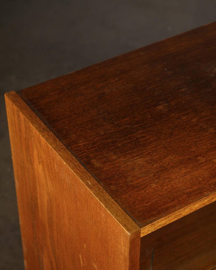 Old TV cabinet with brass handles.