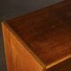 Old TV cabinet with brass handles.