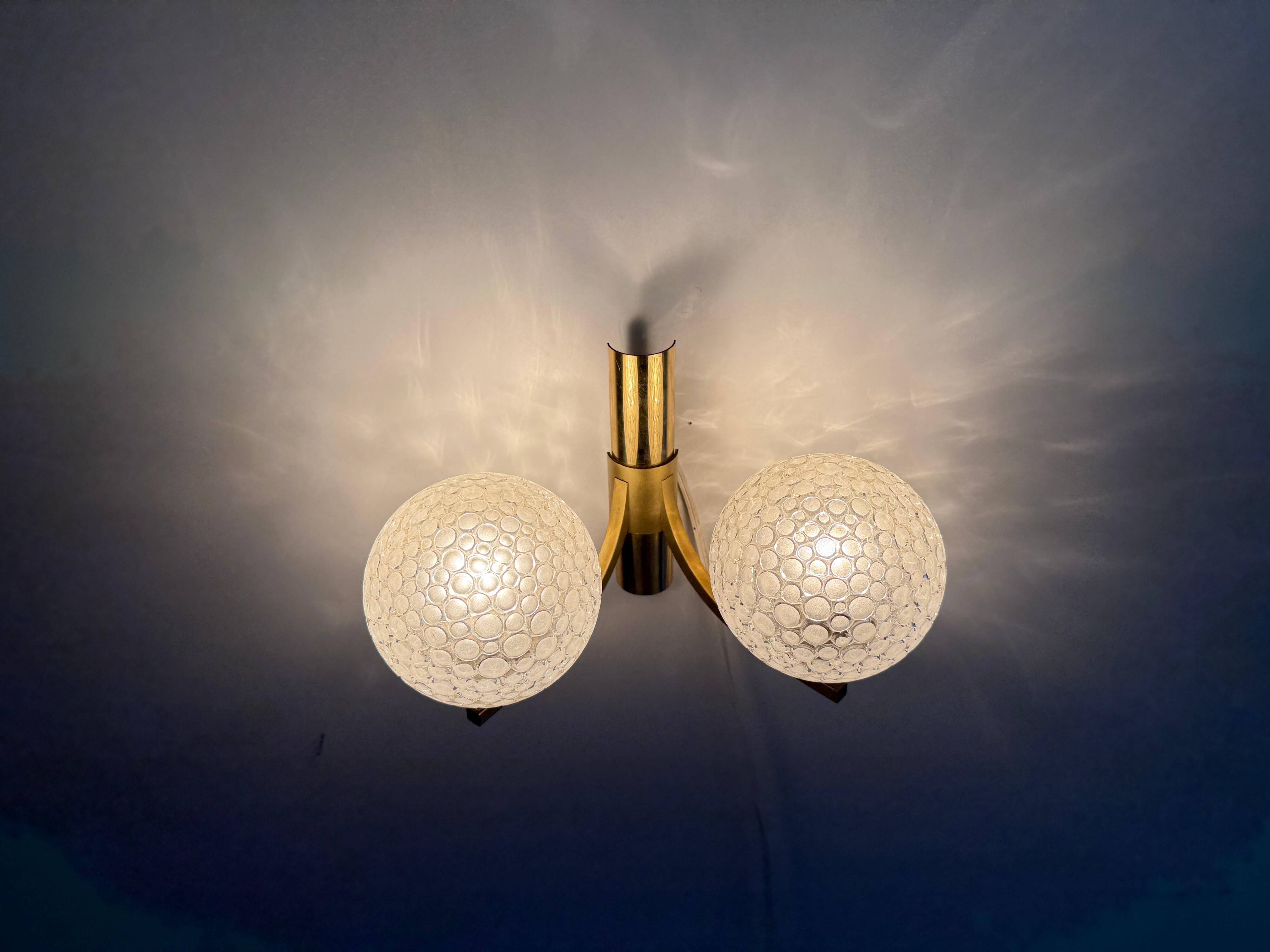 Simple two-armed wall light in brass and glass by Ball and Ball, Kaiser, 1960s, Germany.