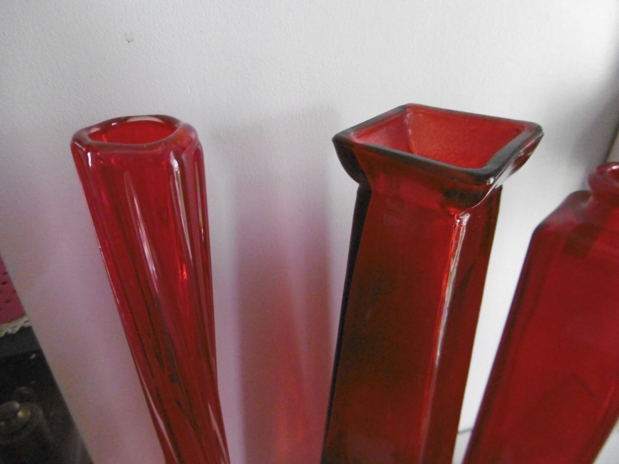 Set of three red bottles