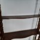 Turned wooden wall shelf