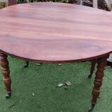 Walnut shuttered table, on casters