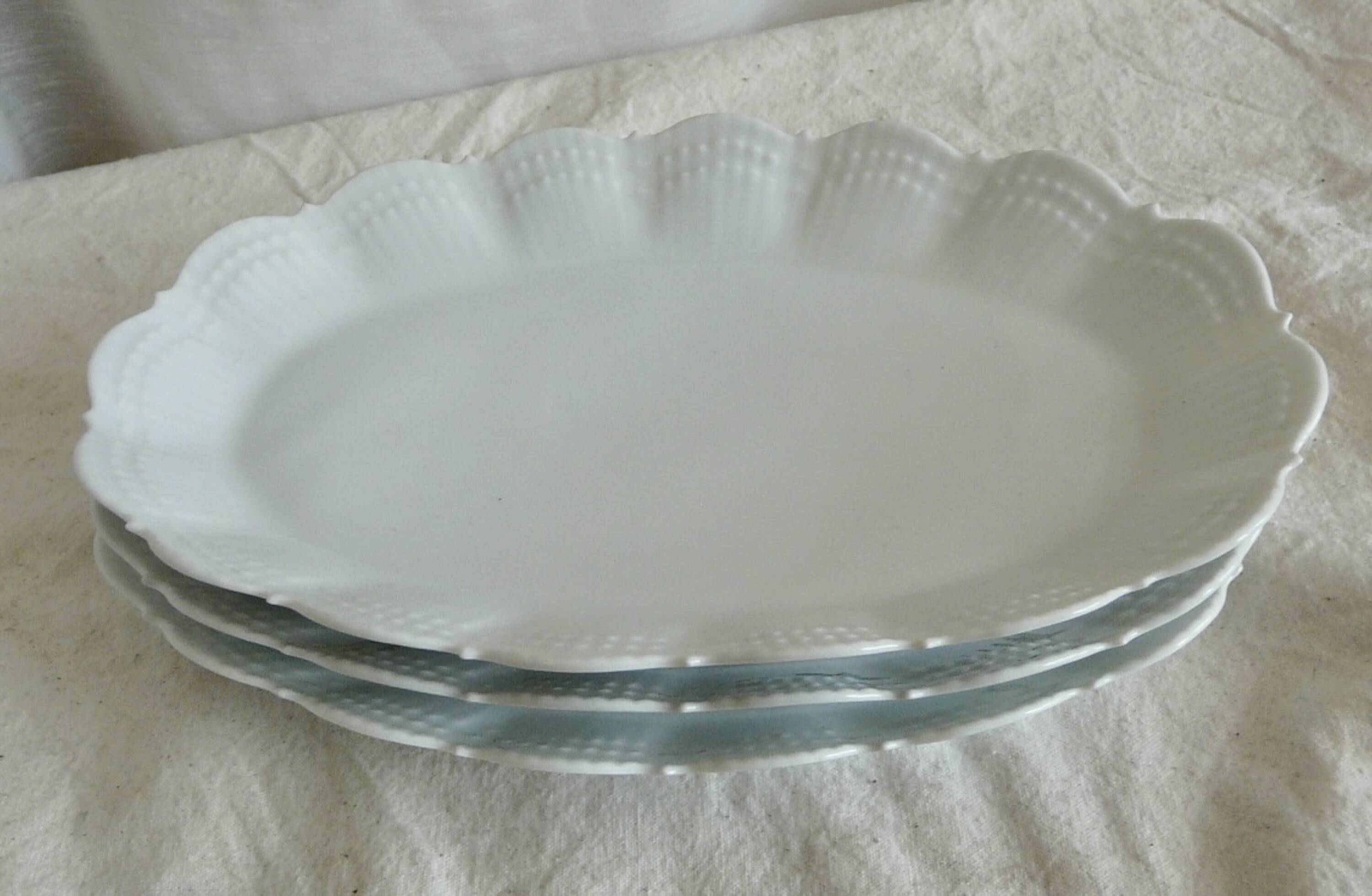 Service of 4 white porcelain dishes from Limoges Art Deco