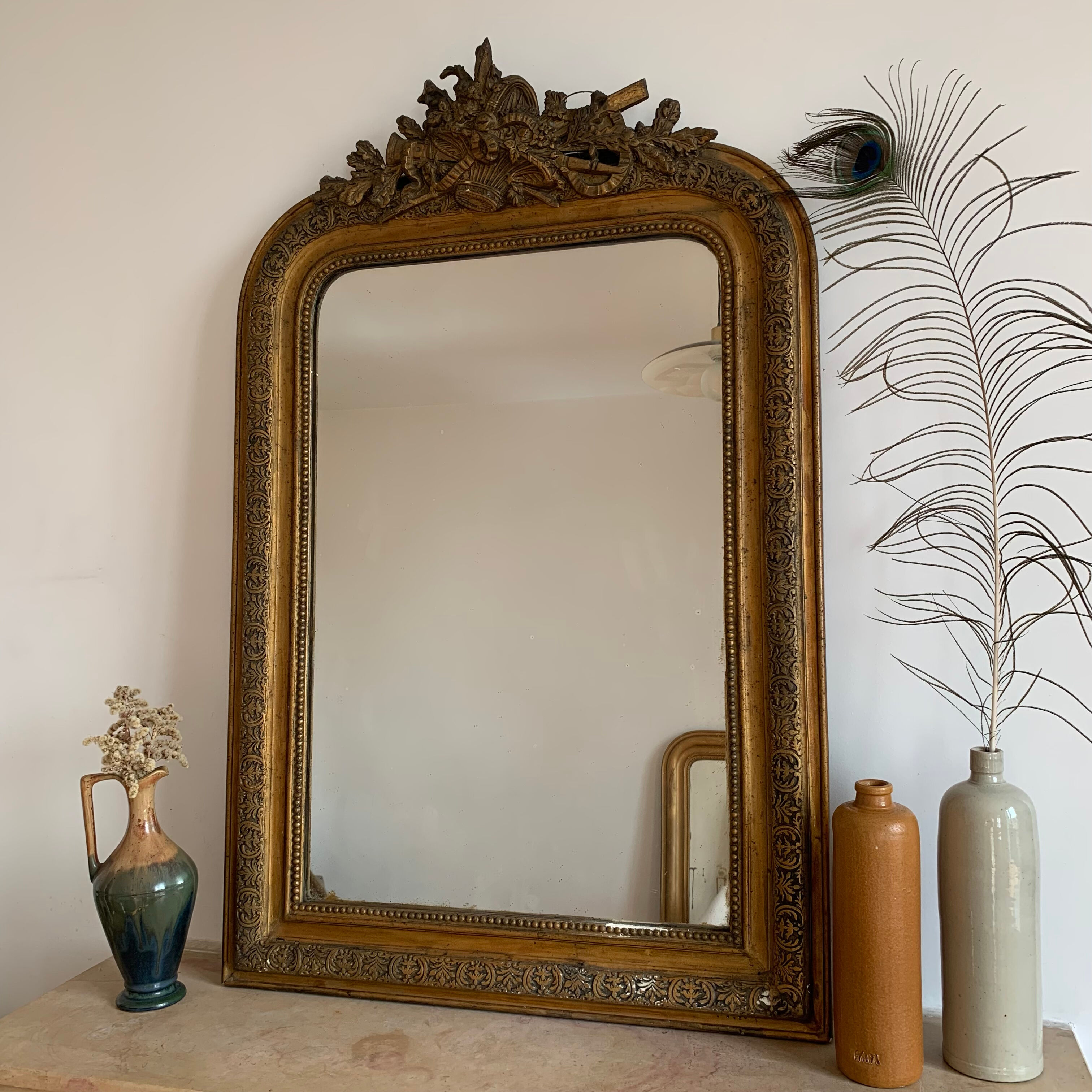 Miroir Louis Philippe patine doré et ornements