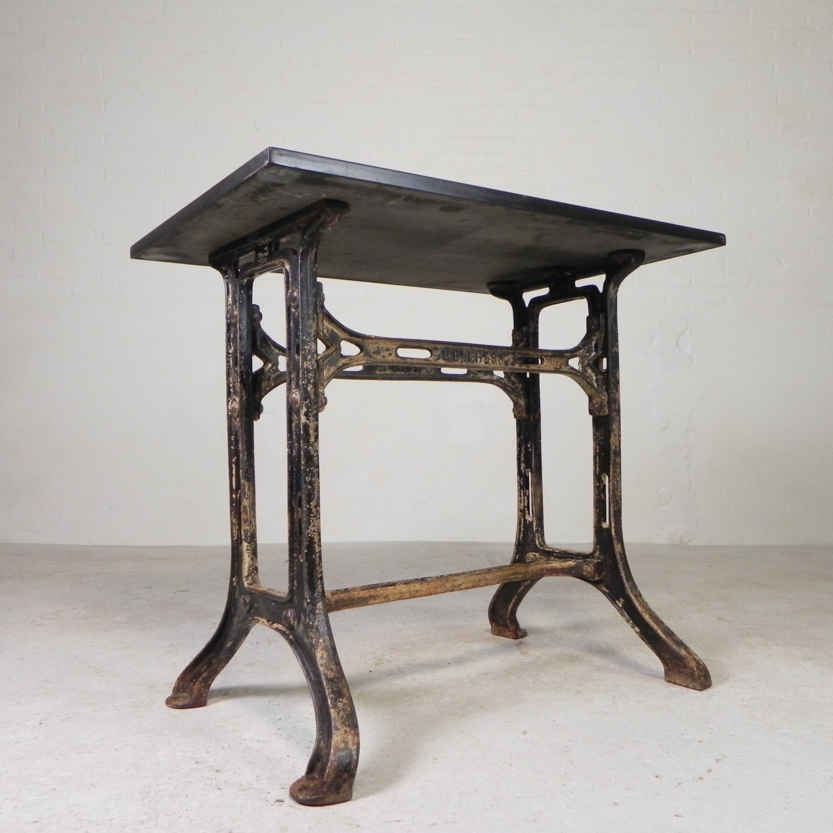 Industrial table, garden table with hard stone slab on cast iron frame, 1930s
