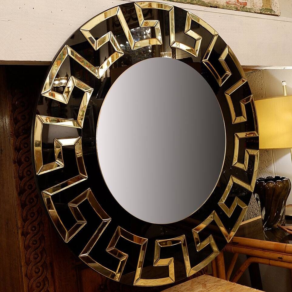Pair of black and gold glass mirrors