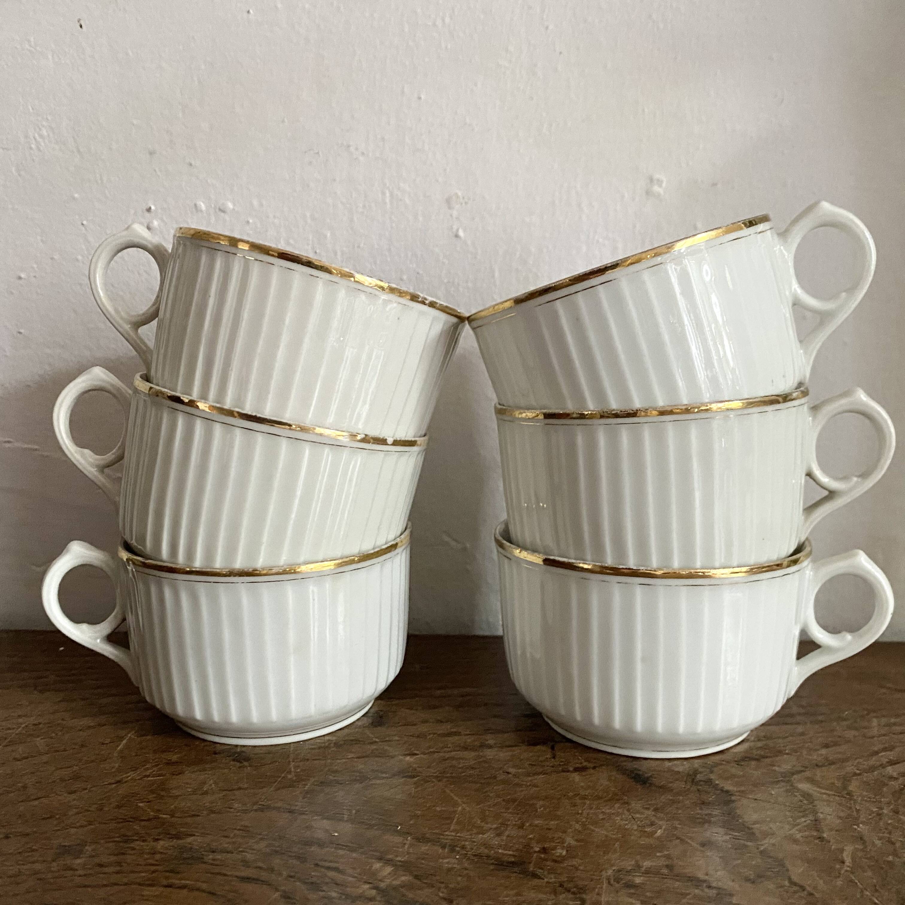 White and gold porcelain cups