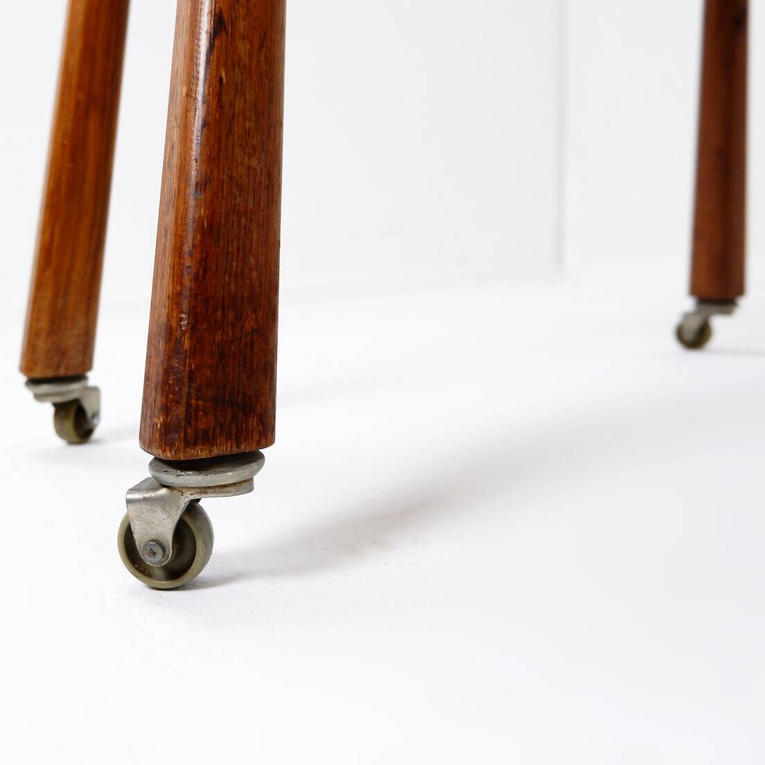 Vintage solid wood side table on casters
