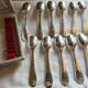 12 silver-plated metal teaspoons with a hallmark of 18.