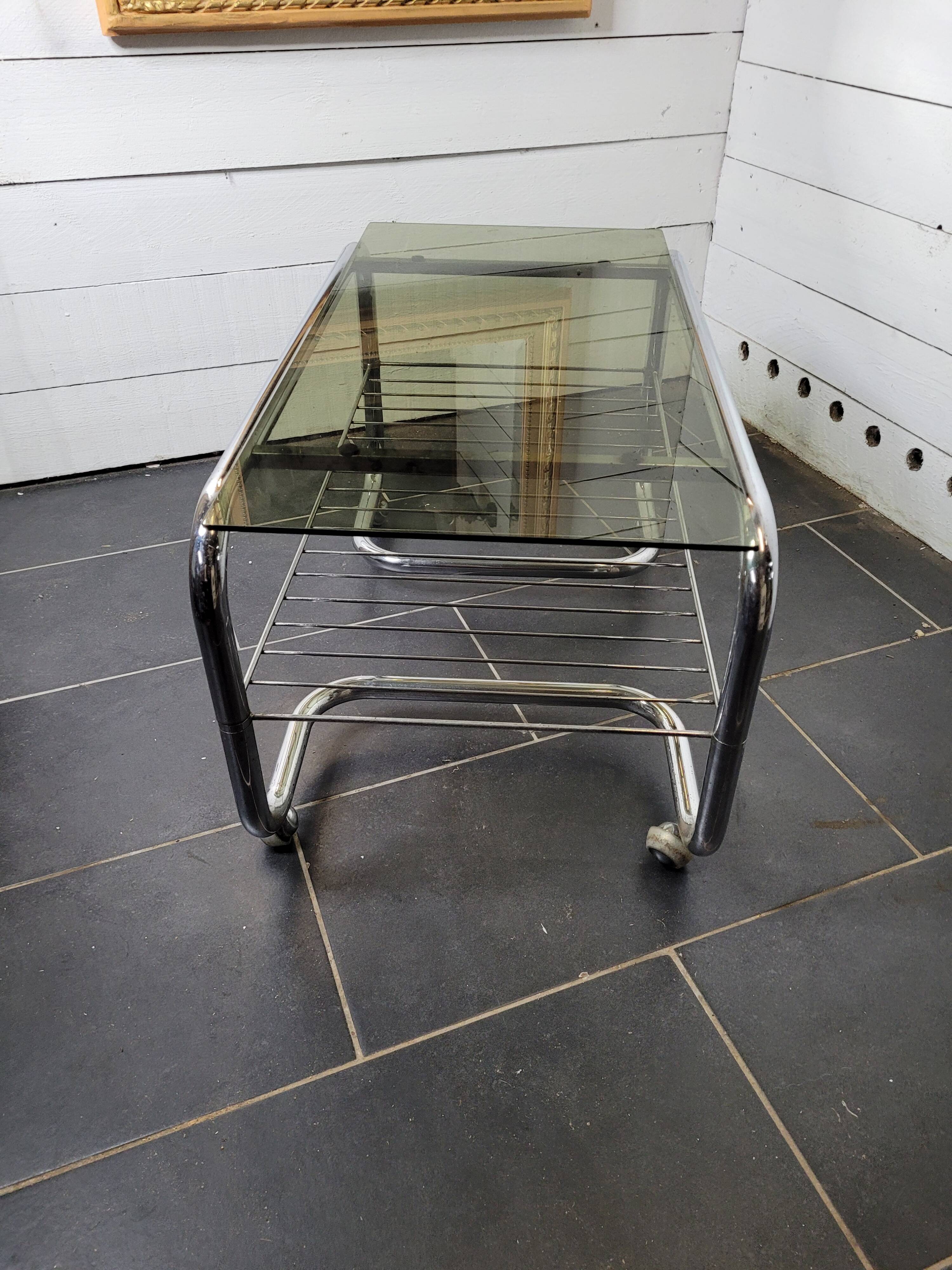 Coffee table with chrome base and smoked glass from the 70s