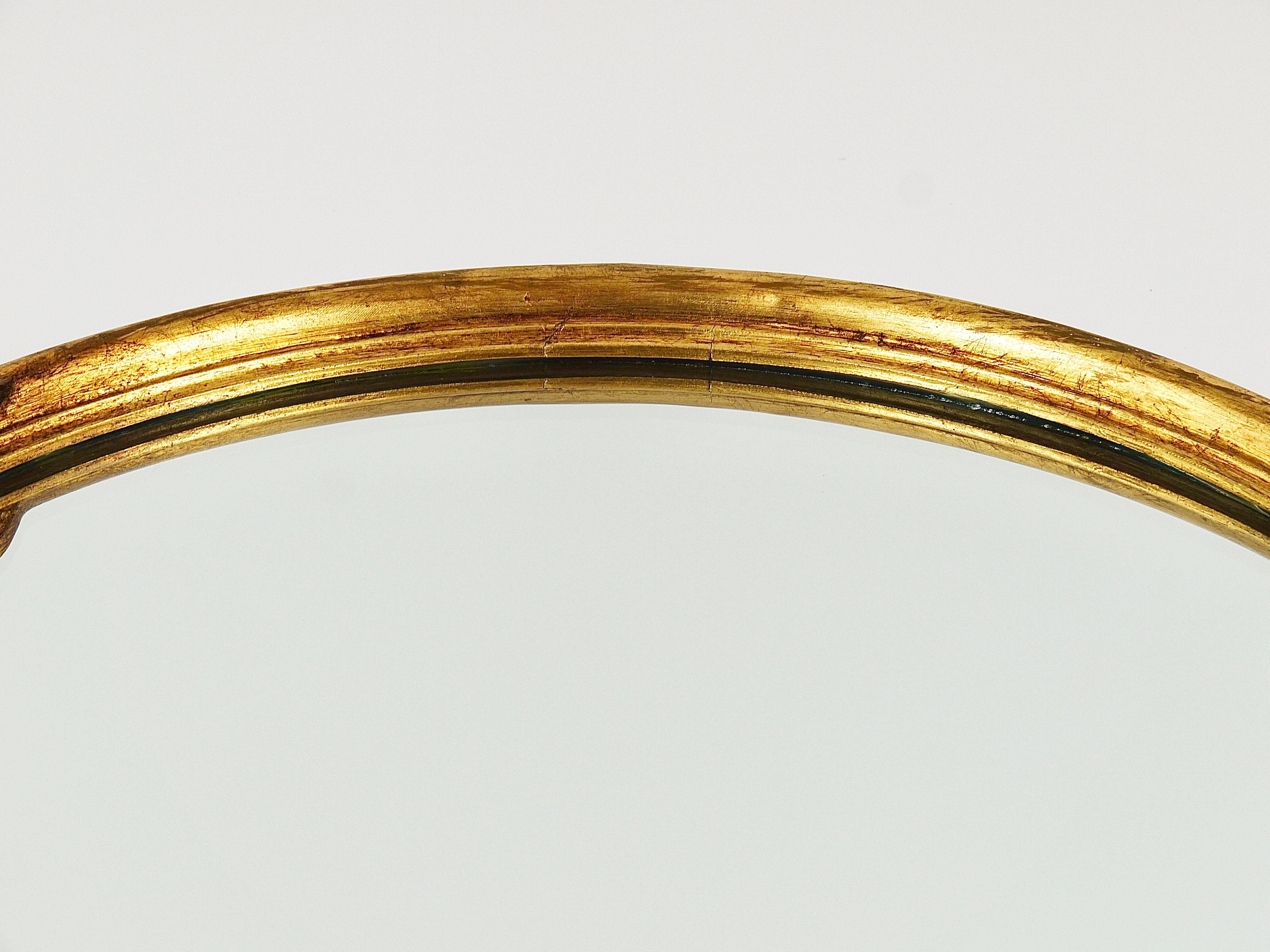 Round wall mirror in gilded wood, mid-century, C. Allodi & G. Subelli, Italy, 1950s.